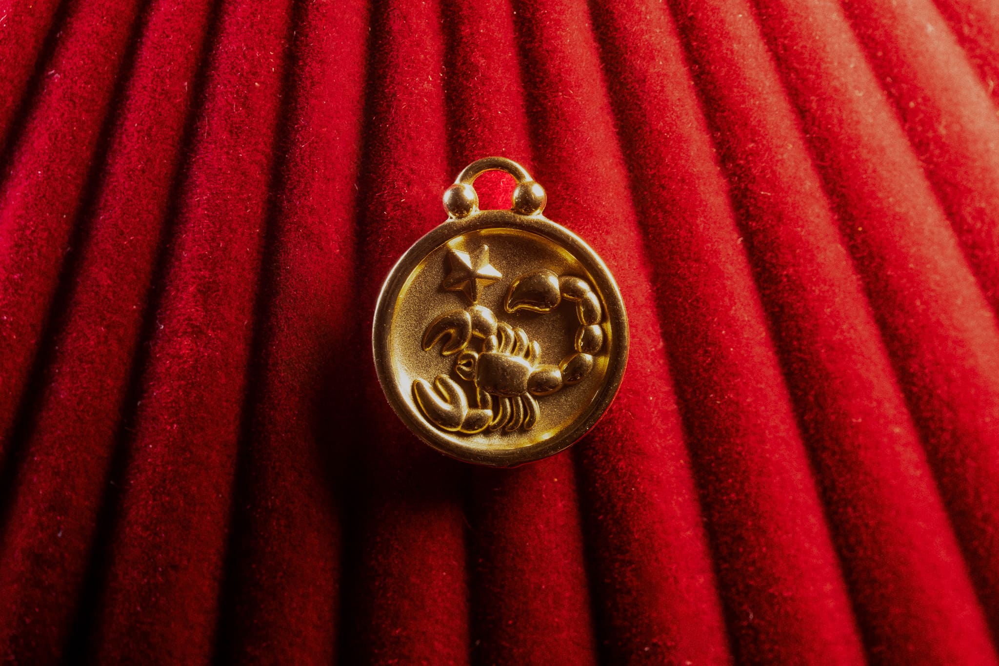 Scorpio pendant a red textured background