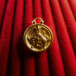 Taurus pendant on a red textured background