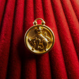 Taurus pendant on a red textured background