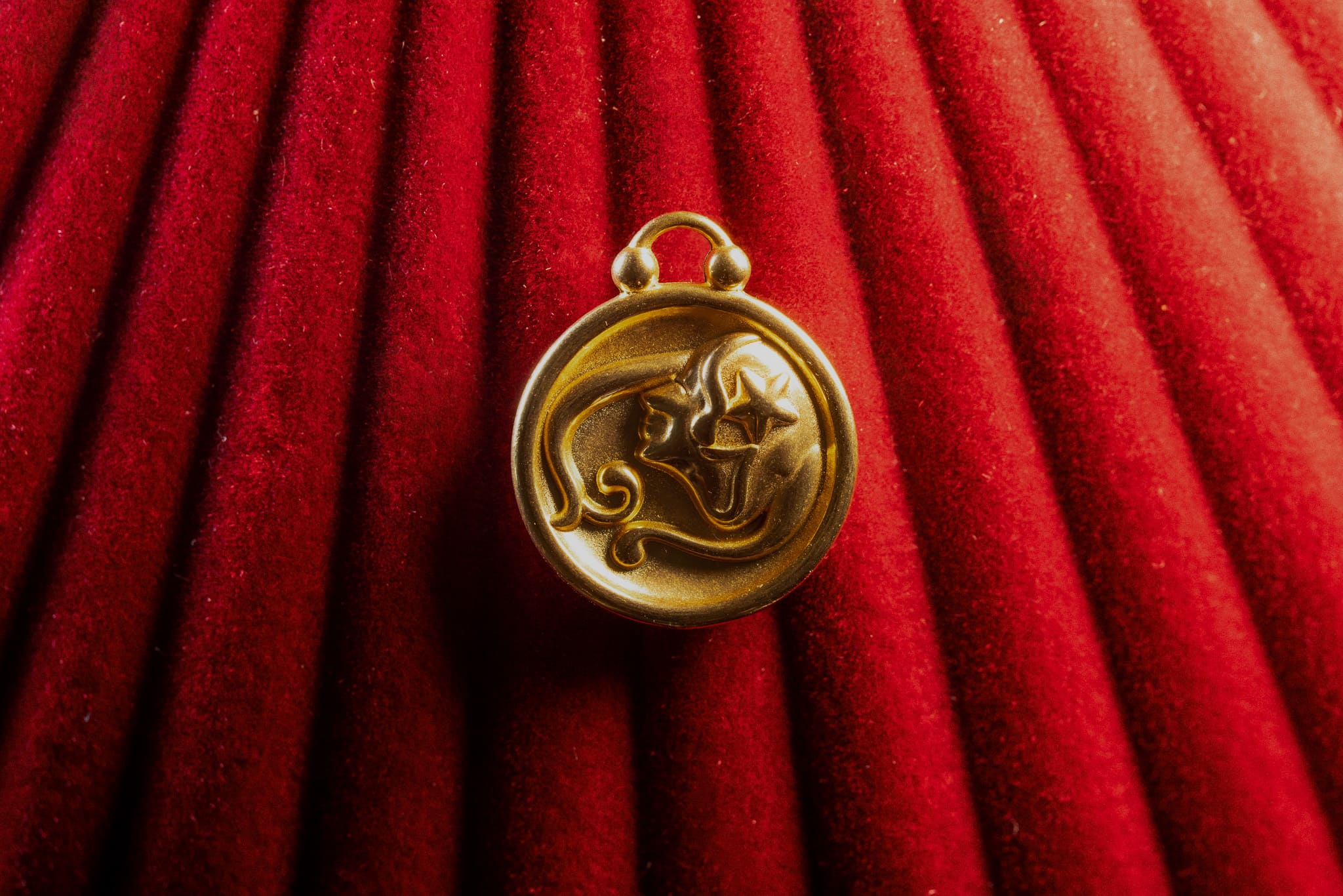 Virgo Pendant on a red textured background