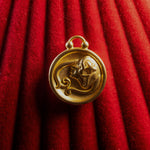 Virgo Pendant on a red textured background