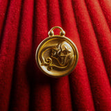 Virgo Pendant on a red textured background