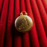 Gold Pendant watch with Capricorn Constellation on a red textured background