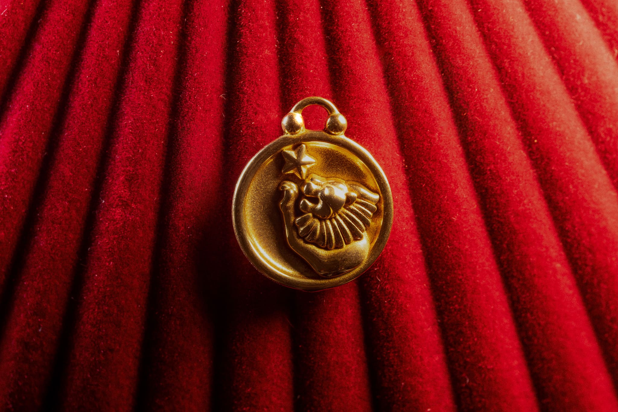 Leo pendant on a red textured background