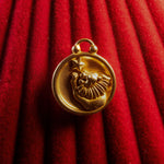 Leo pendant on a red textured background
