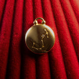 Gold pendant with Scorpio Constellation on a red textured background